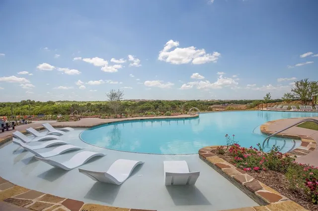 an aerial view of a house with a swimming pool