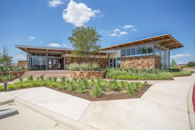 an aerial view of a house with a lake view