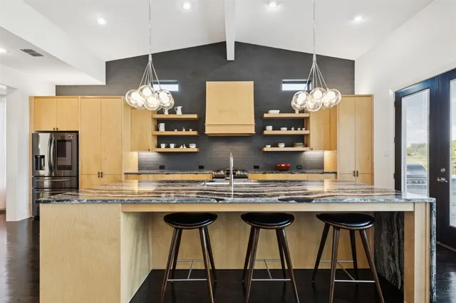 a living room with furniture wooden floor and a flat screen tv