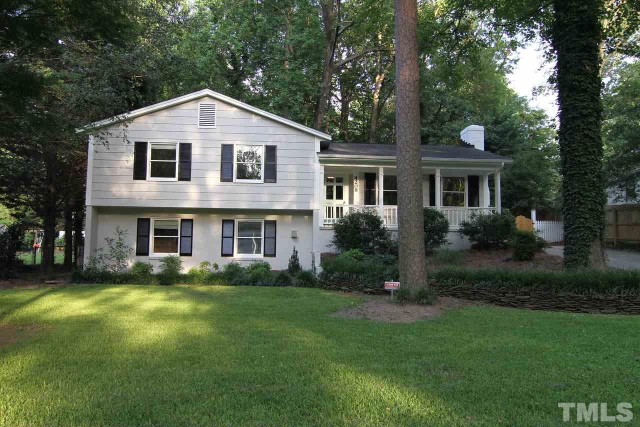 4208 Rowan Street Raleigh, NC 27609 - Photo 1 of 14 a front view of a house with garden