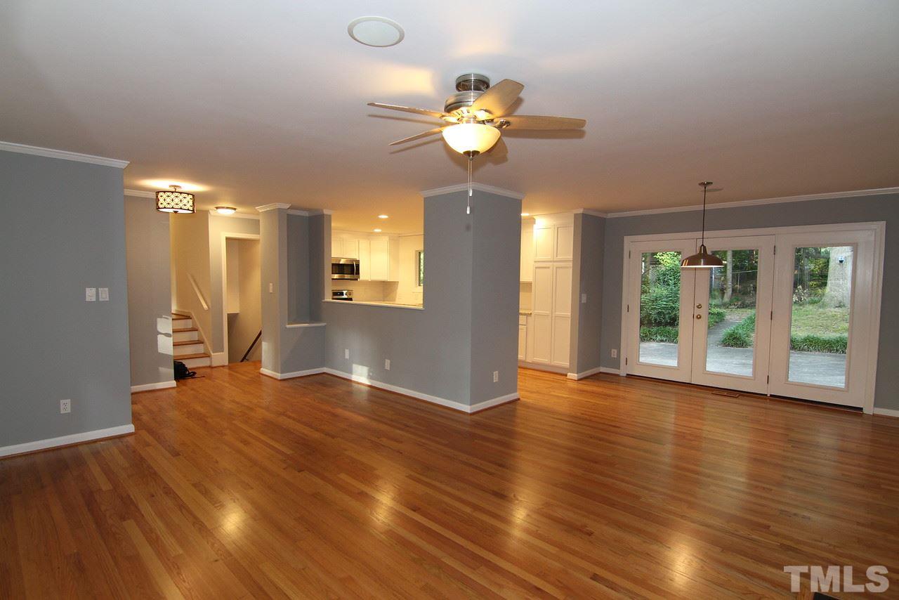 4208 Rowan Street Raleigh, NC 27609 - Photo 2 of 14 a view of an empty room with wooden floor and a window