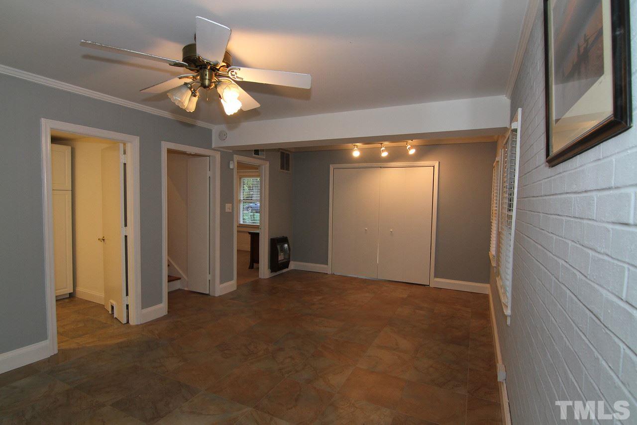4208 Rowan Street Raleigh, NC 27609 - Photo 11 of 14 an empty room with closet and a chandelier fan