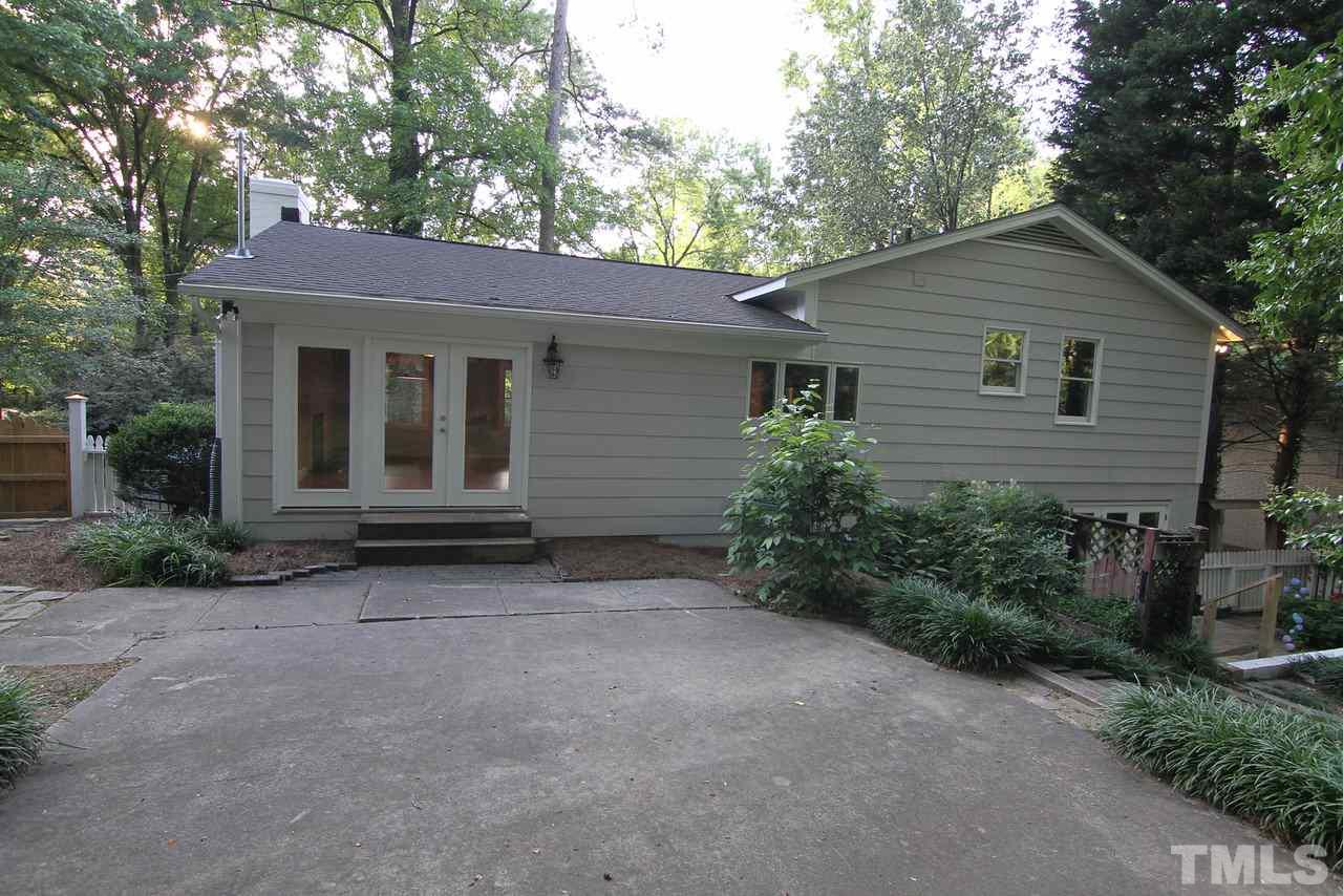 4208 Rowan Street Raleigh, NC 27609 - Photo 13 of 14 a view of house with a yard and potted plants