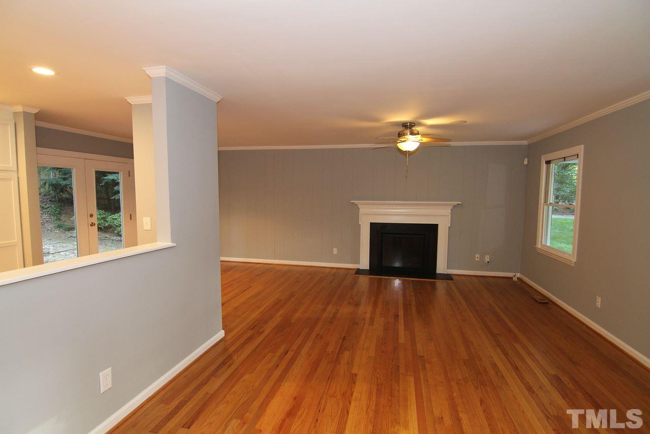 4208 Rowan Street Raleigh, NC 27609 - Photo 6 of 14 a view of an empty room with wooden floor and a window