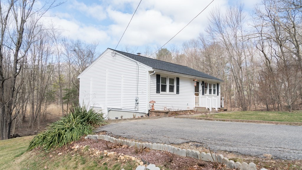 75 Fairview Park Road Sturbridge, MA 01566 - Photo 2 of 13 a view of a white house with a white fence next to a road