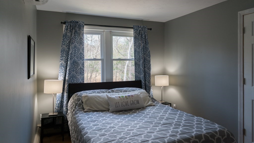 75 Fairview Park Road Sturbridge, MA 01566 - Photo 9 of 13 a bedroom with a large bed and a window