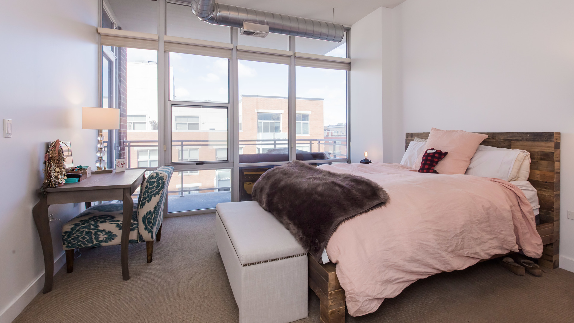 901 West Madison Street, Unit 609 Chicago, IL 60607 - Photo 13 of 22 a bedroom with a bed and a large window