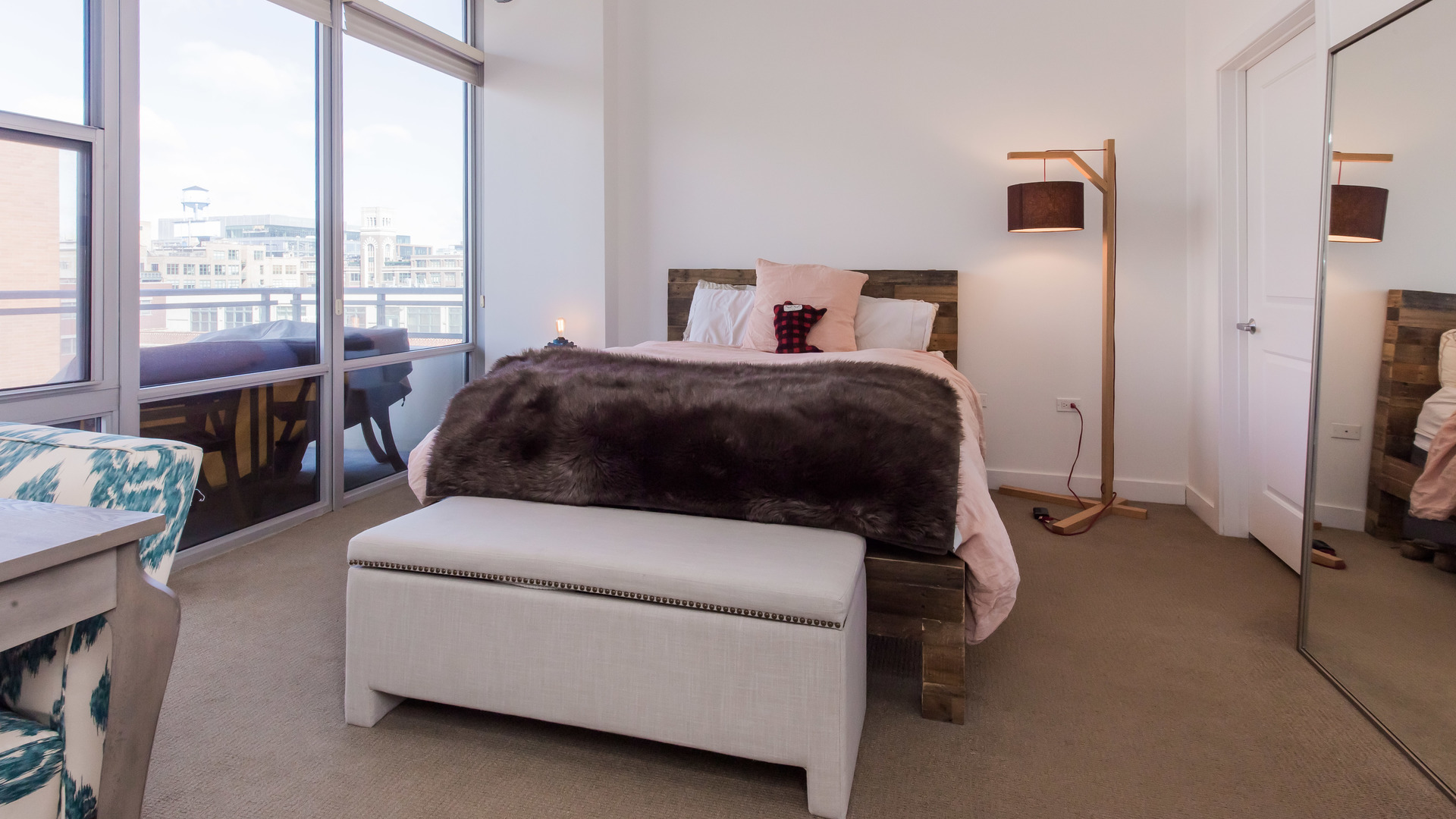 901 West Madison Street, Unit 609 Chicago, IL 60607 - Photo 14 of 22 a bedroom with a bed chair and a large window