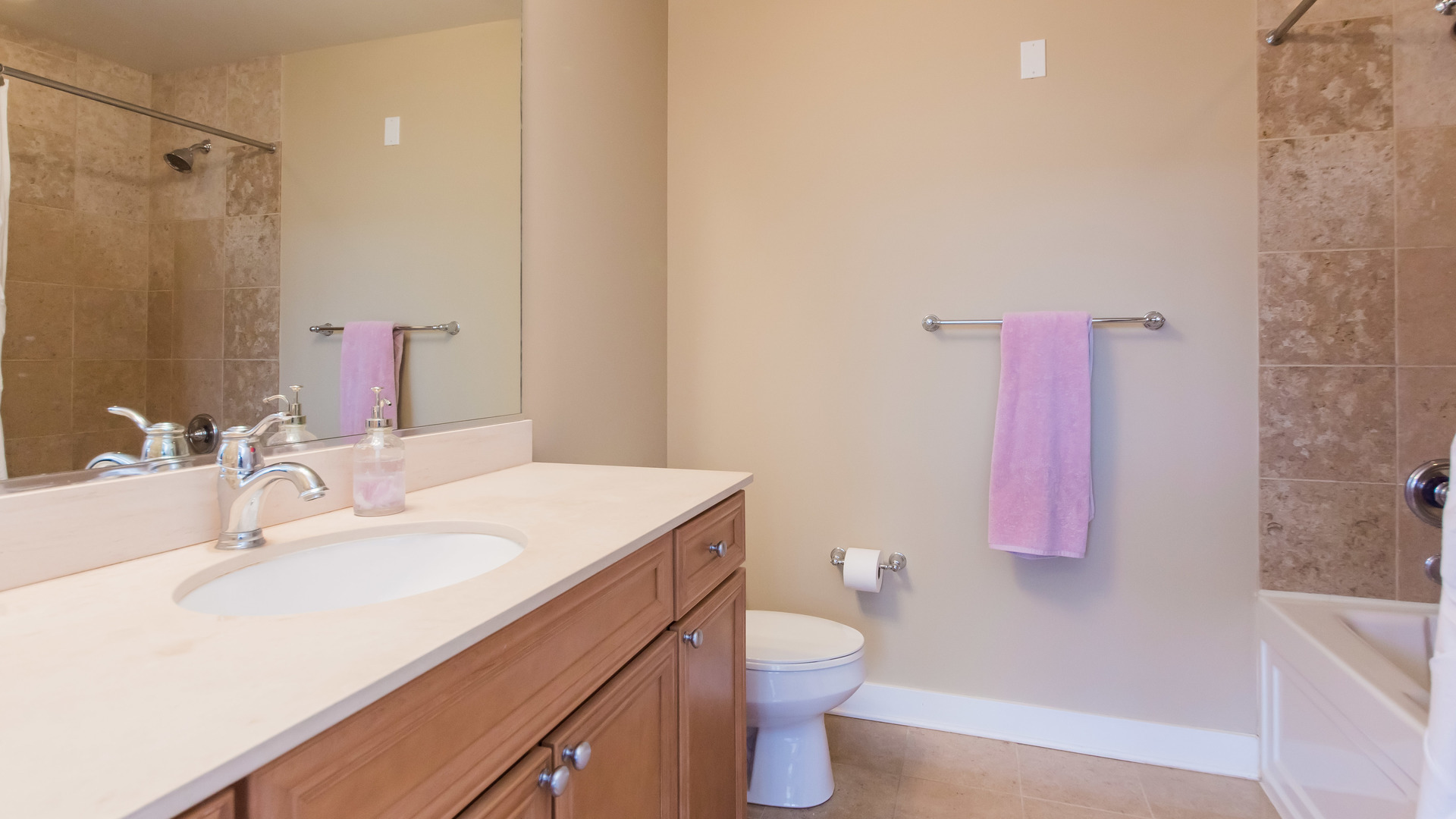 901 West Madison Street, Unit 609 Chicago, IL 60607 - Photo 15 of 22 a bathroom with a sink toilet vanity and shower