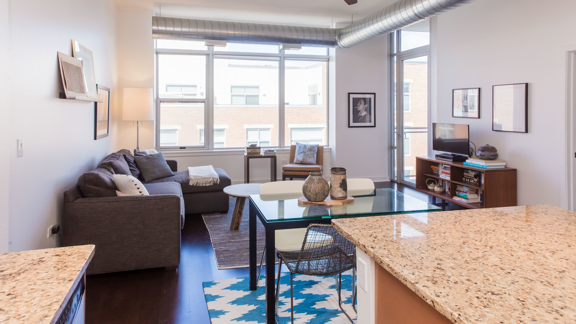 901 West Madison Street, Unit 609 Chicago, IL 60607 - Photo 9 of 22 a living room with furniture wooden floor and a large window