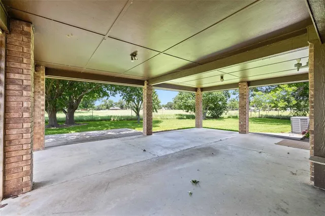 a view of a garden with a building in the background