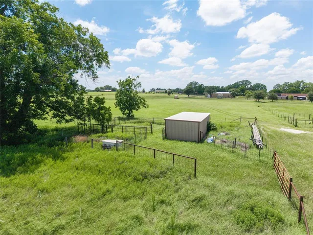 a view of a garden with an outdoor space