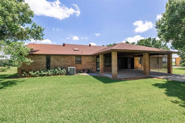 a front view of a house with a garden and porch