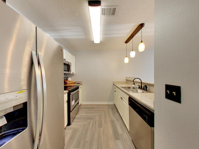 487 Keystone Road, Unit 487 Mary Esther, FL 32569 - Photo 10 of 28 a kitchen with stainless steel appliances granite countertop a refrigerator a stove and a refrigerator