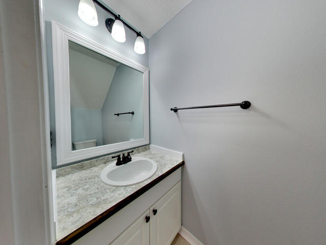 487 Keystone Road, Unit 487 Mary Esther, FL 32569 - Photo 13 of 28 a bathroom with a granite countertop sink and a mirror