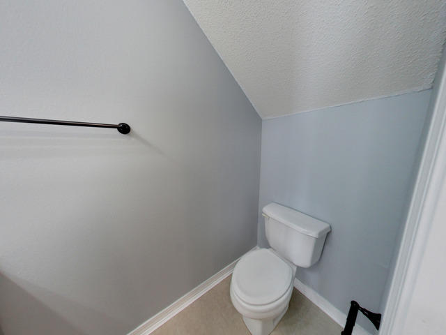 487 Keystone Road, Unit 487 Mary Esther, FL 32569 - Photo 14 of 28 a white toilet sitting next to a shower