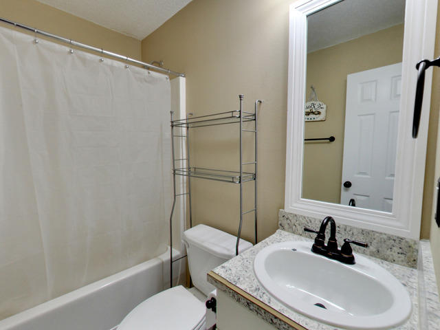 487 Keystone Road, Unit 487 Mary Esther, FL 32569 - Photo 24 of 28 a bathroom with a sink toilet and shower