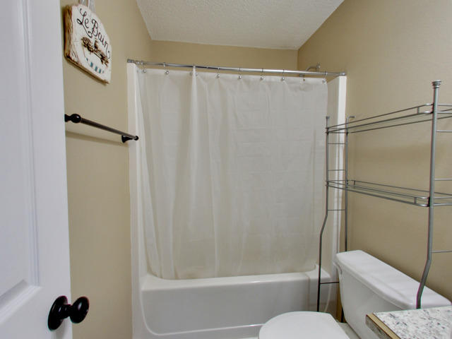 487 Keystone Road, Unit 487 Mary Esther, FL 32569 - Photo 25 of 28 a bathroom with a shower and a toilet