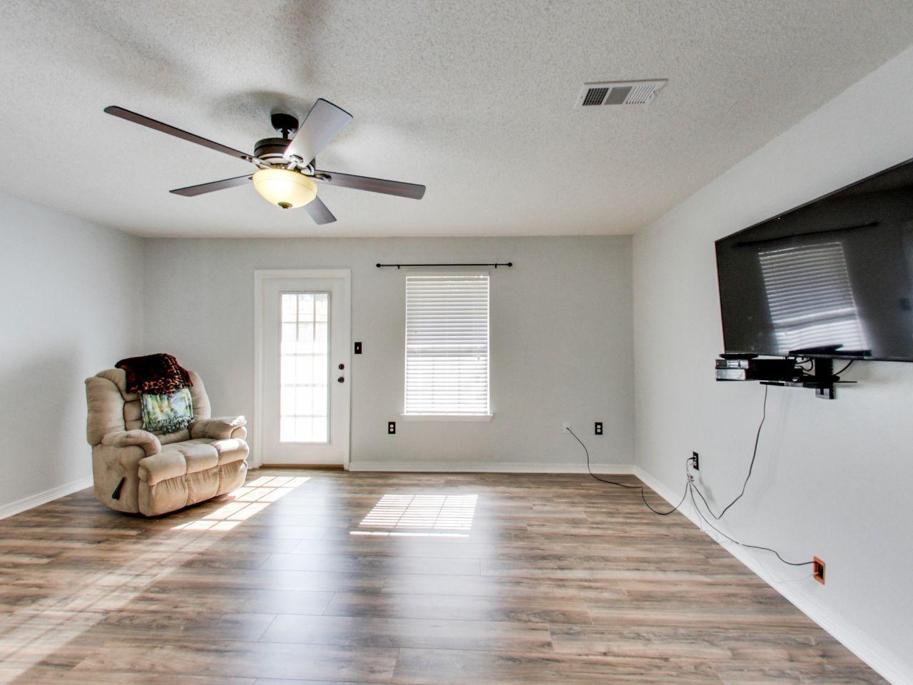 487 Keystone Road, Unit 487 Mary Esther, FL 32569 - Photo 5 of 28 a living room with furniture and a flat screen tv