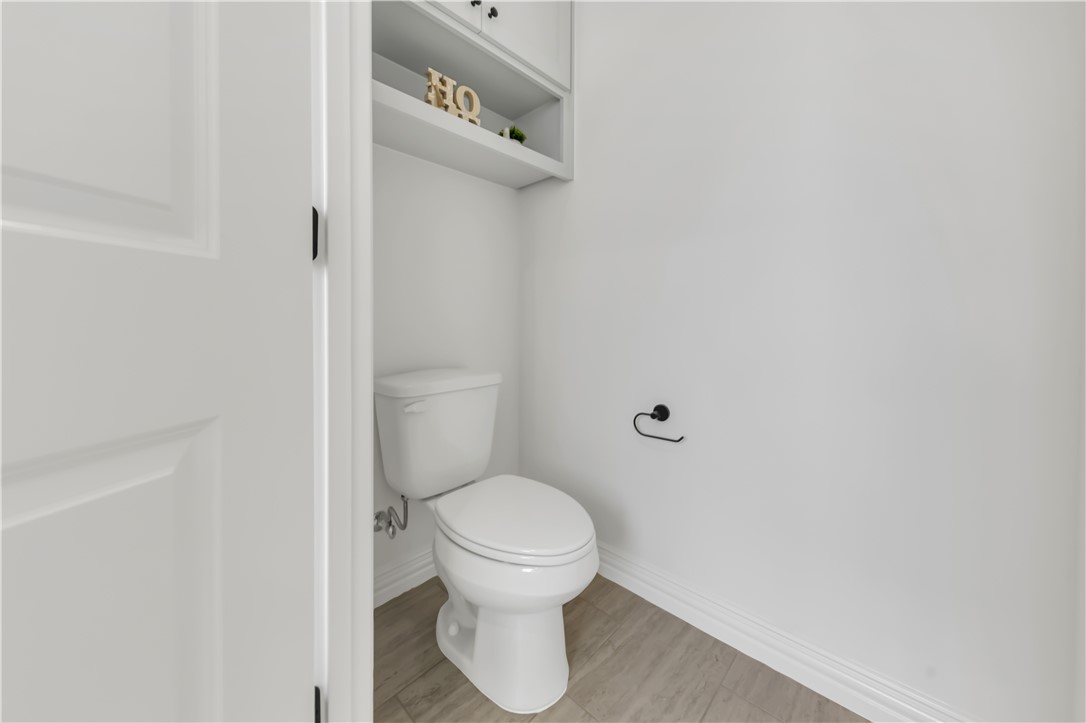 3310 Hunters Crossing Bryan, TX 77808 - Photo 26 of 34 Bathroom featuring toilet and baseboards
