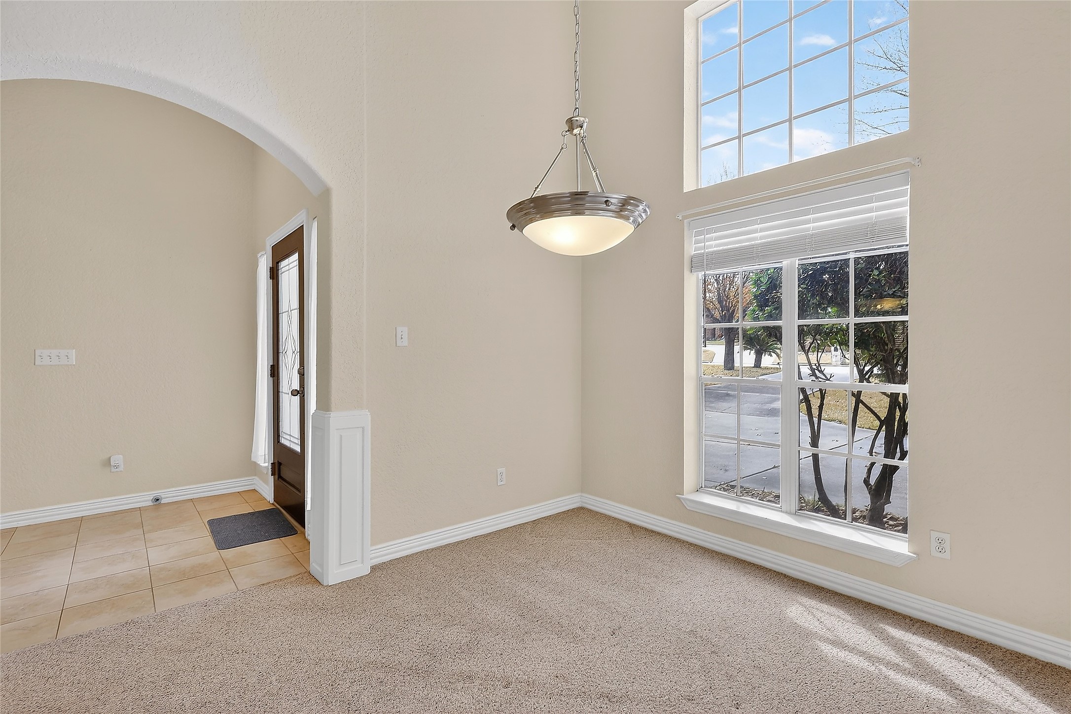 89 Dawns Edge Conroe, TX 77356 - Photo 18 of 46 Bright dining area featuring large windows, soaring ceilings, and abundant natural light.