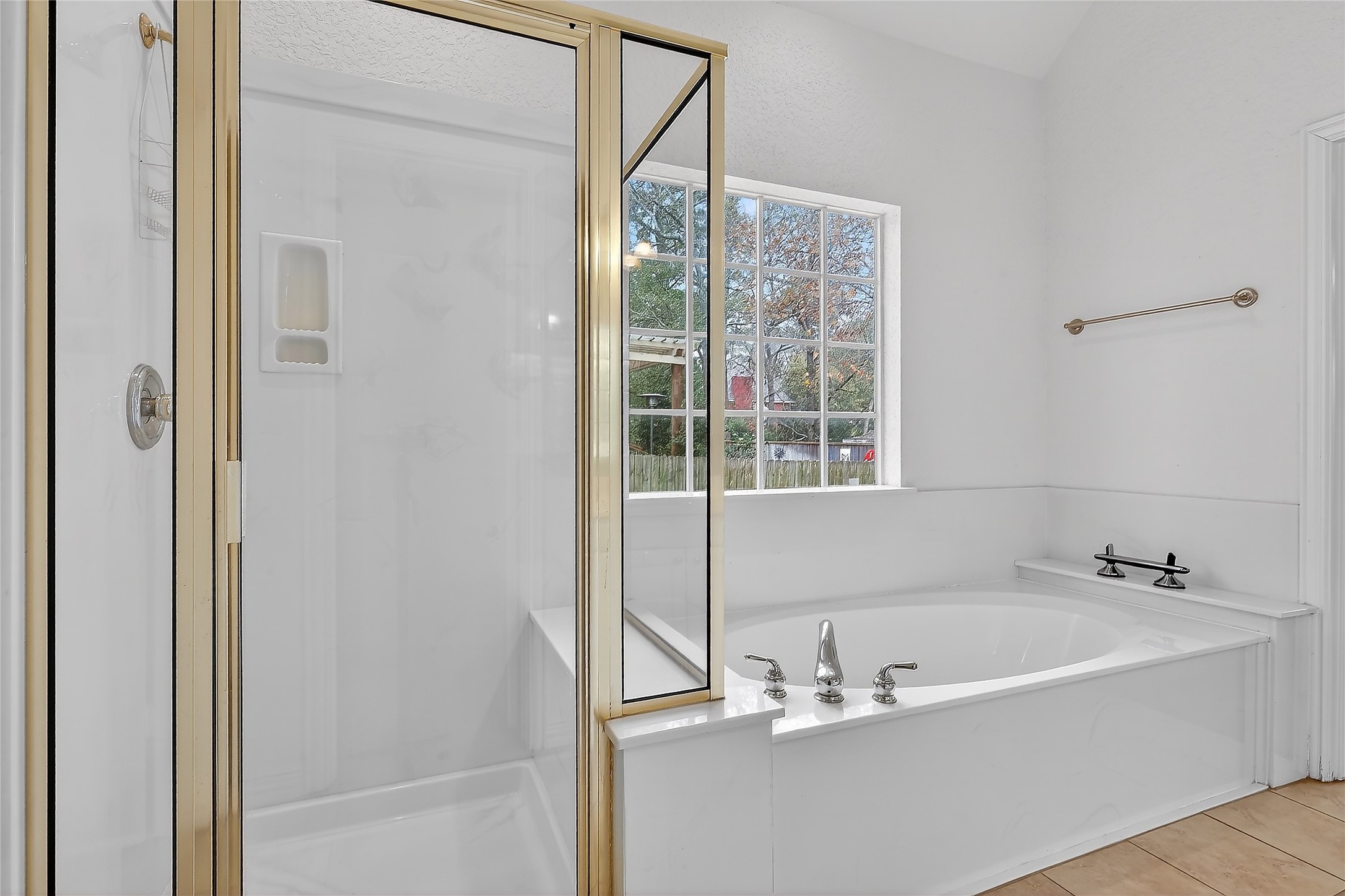 89 Dawns Edge Conroe, TX 77356 - Photo 27 of 46 Separate soaking tub and glass-enclosed shower offer both relaxation and everyday functionality.