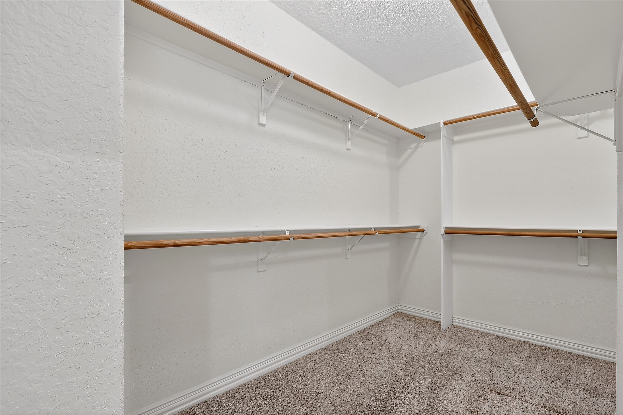 89 Dawns Edge Conroe, TX 77356 - Photo 29 of 46 Large walk-in closet offers extended hanging rods and generous organization space.