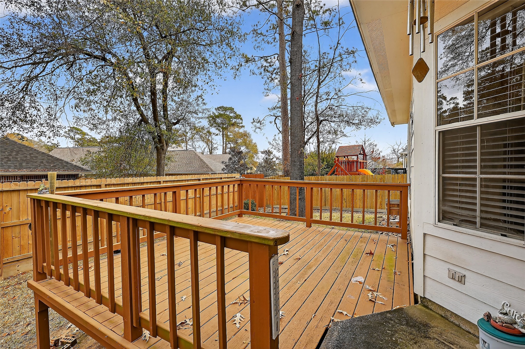 89 Dawns Edge Conroe, TX 77356 - Photo 3 of 46 Enjoy quiet mornings and shaded evenings on this private backyard deck — ideal for grilling, gathering, and unwinding at home.