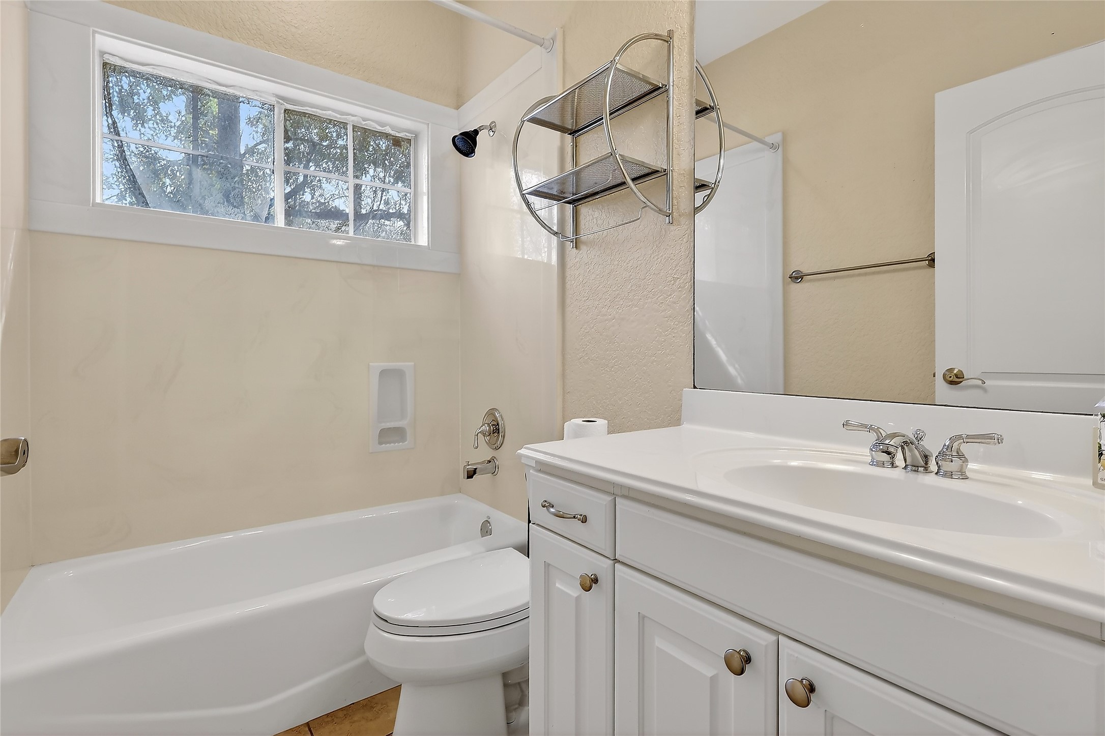 89 Dawns Edge Conroe, TX 77356 - Photo 38 of 46 Secondary bath offers tub/shower combo, vanity storage, and natural light window.