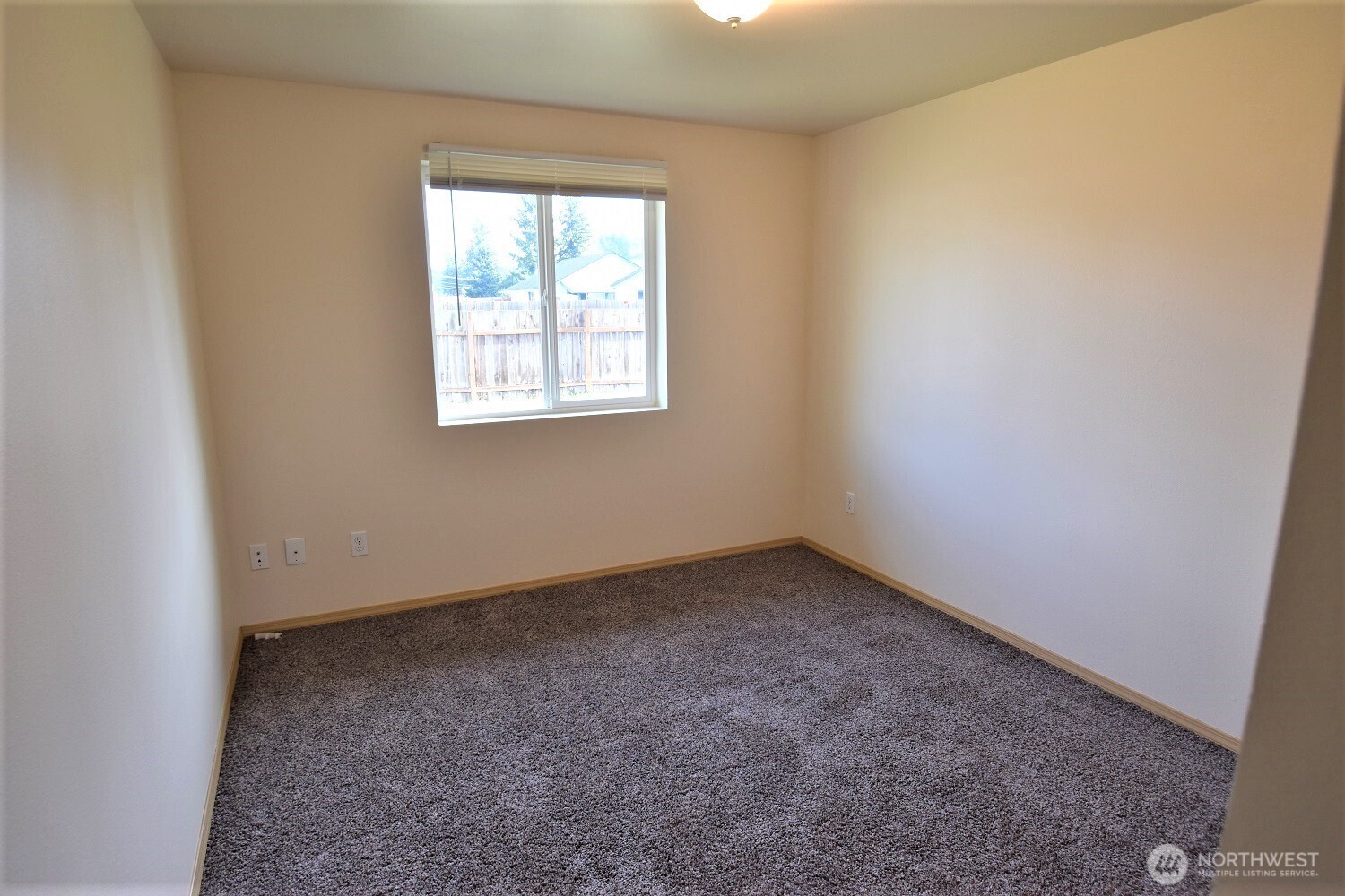 19906 Tamarack Drive Southwest Rochester, WA 98579 - Photo 6 of 12 an empty room with a window