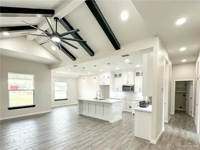 a view of kitchen and windows