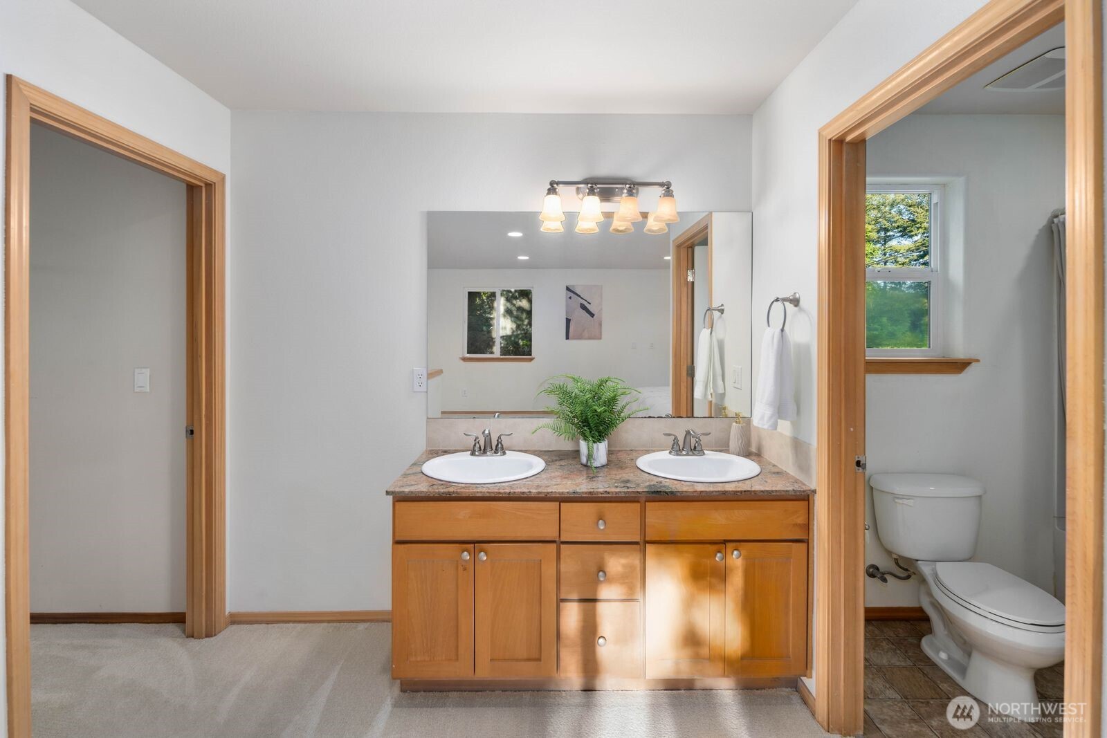 22217 Old Owen Road Monroe, WA 98272 - Photo 26 of 34 a bathroom with a sink a toilet and mirror