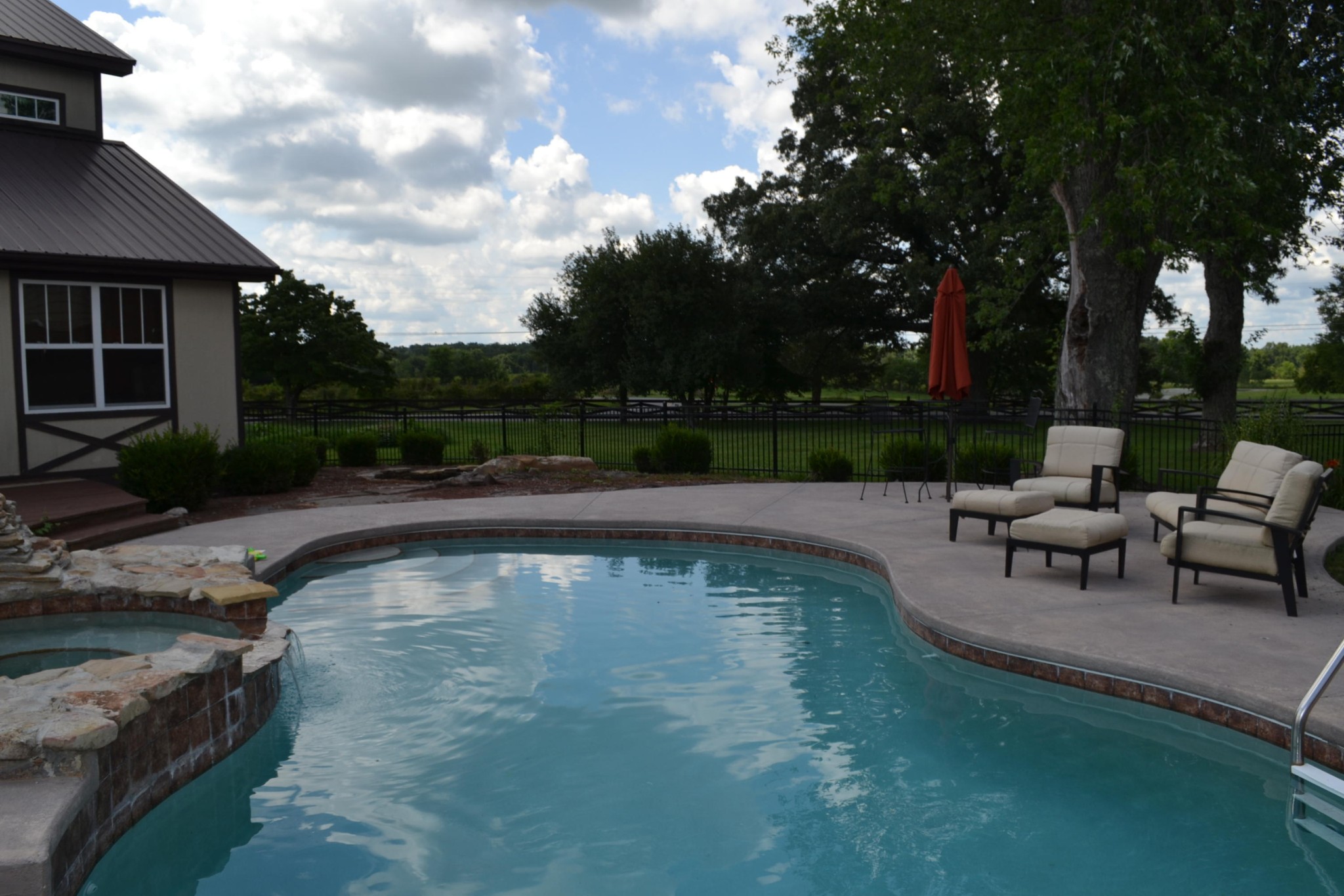 2306 Deep Draw Road Crossville, TN 38555 - Photo 15 of 40 a view of a swimming pool with sitting area