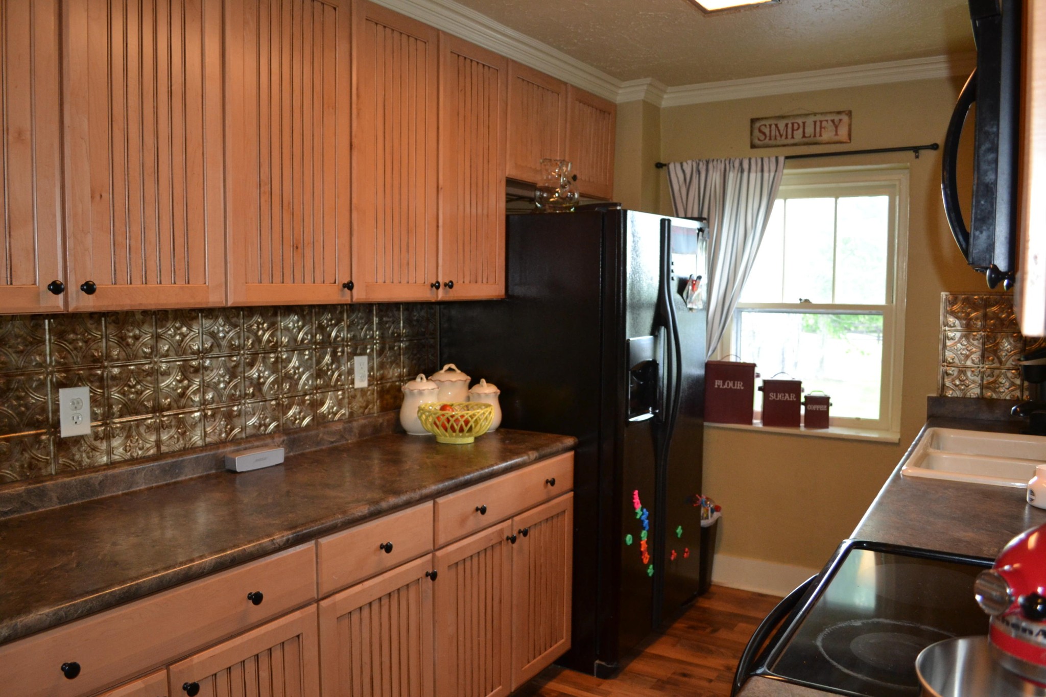 2306 Deep Draw Road Crossville, TN 38555 - Photo 20 of 40 a kitchen with granite countertop a refrigerator wooden floor and a window