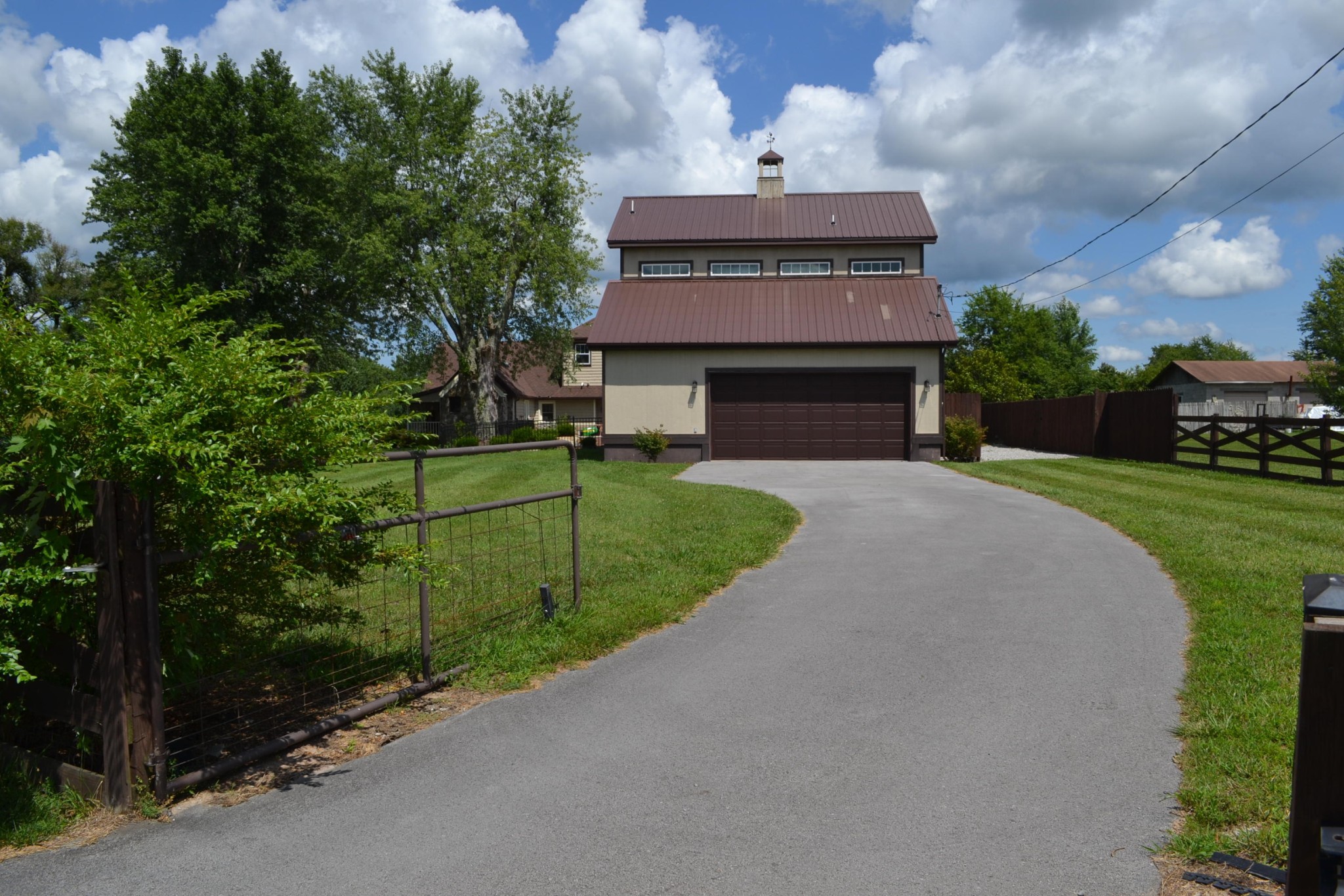 2306 Deep Draw Road Crossville, TN 38555 - Photo 8 of 40 a front view of a house with a yard and garage