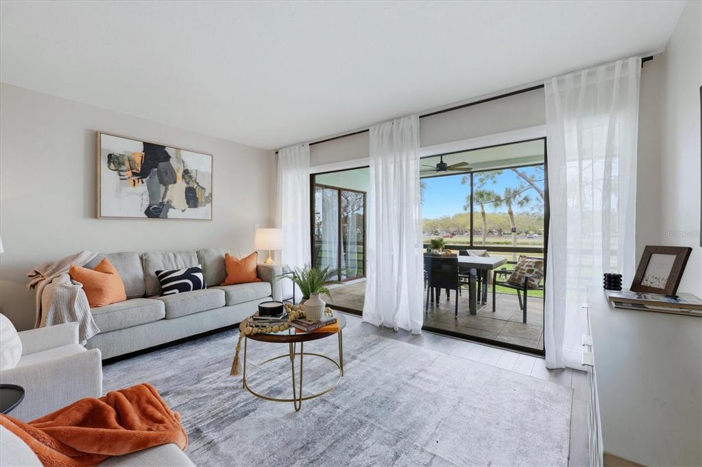 5058 Marsh Field Road, Unit 8 Sarasota, FL 34235 - Photo 11 of 73 a living room with furniture and a large window