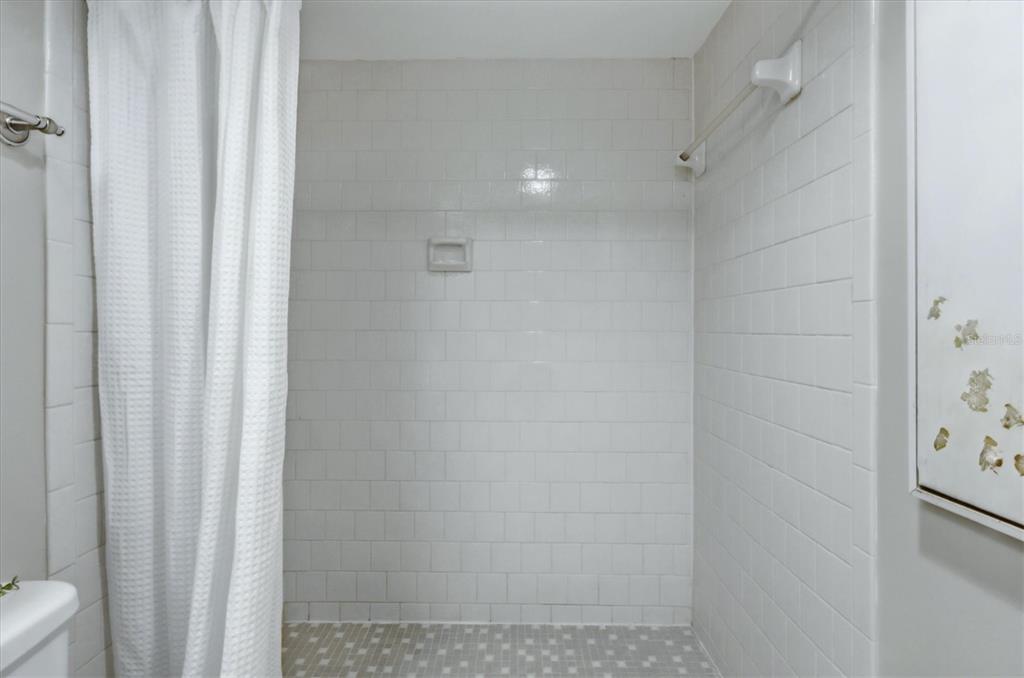 5058 Marsh Field Road, Unit 8 Sarasota, FL 34235 - Photo 19 of 73 a bathroom with a shower
