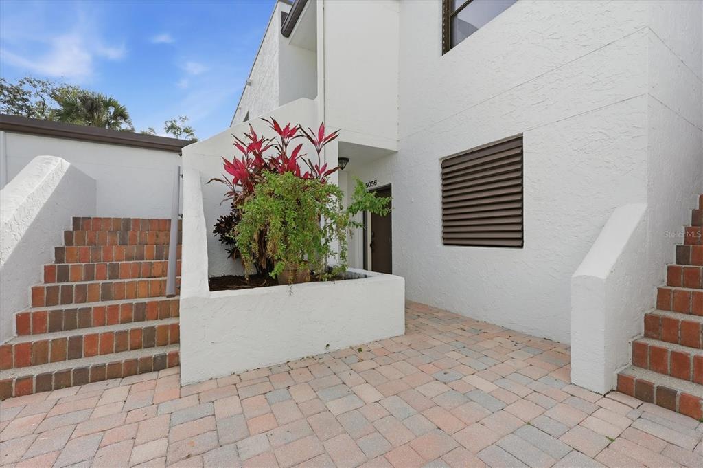 5058 Marsh Field Road, Unit 8 Sarasota, FL 34235 - Photo 2 of 73 a view of front door and wooden floor
