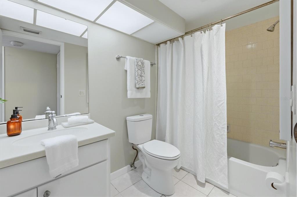 5058 Marsh Field Road, Unit 8 Sarasota, FL 34235 - Photo 22 of 73 a bathroom with a sink a toilet and shower