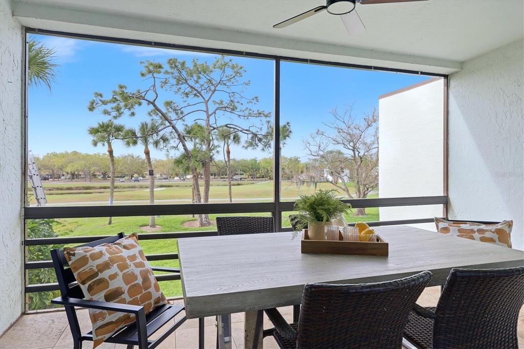 5058 Marsh Field Road, Unit 8 Sarasota, FL 34235 - Photo 23 of 73 a view of a dining room with furniture a potted plant and a window
