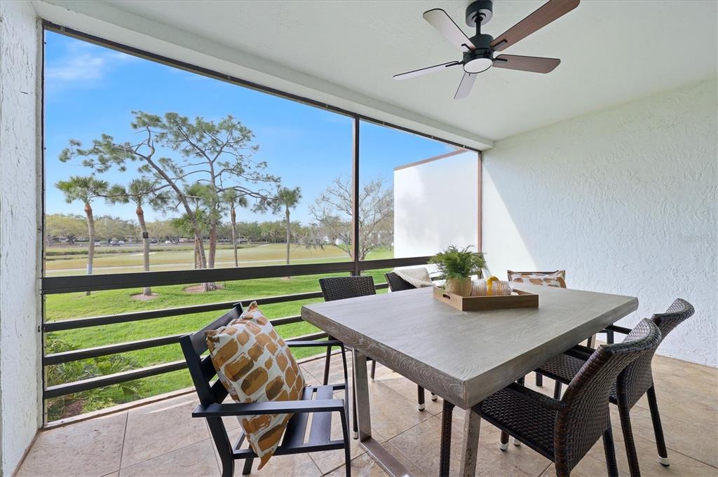 5058 Marsh Field Road, Unit 8 Sarasota, FL 34235 - Photo 24 of 73 a view of a dining room with furniture window and outside view