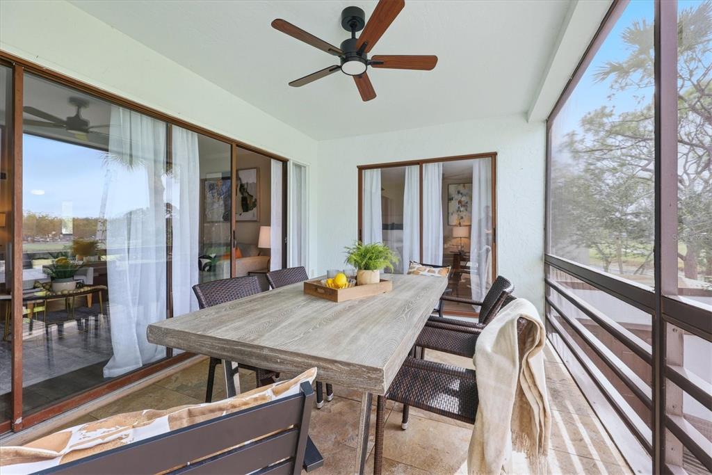 5058 Marsh Field Road, Unit 8 Sarasota, FL 34235 - Photo 25 of 73 a view of a dining room with furniture window and wooden floor