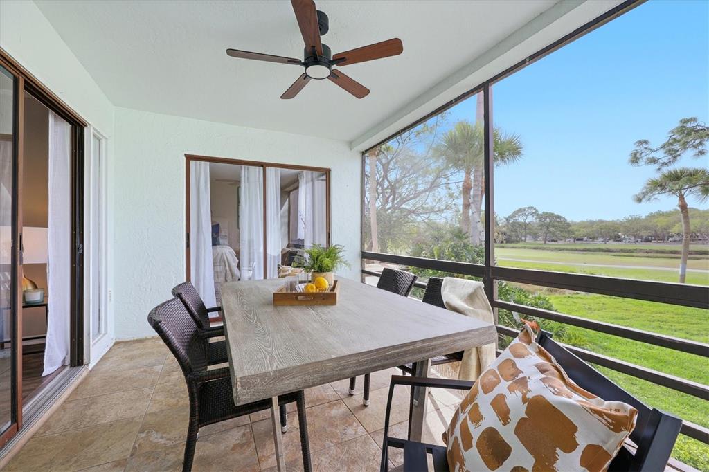5058 Marsh Field Road, Unit 8 Sarasota, FL 34235 - Photo 26 of 73 a view of a dining room with furniture window and outside view