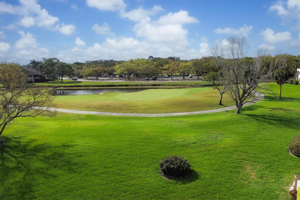 5058 Marsh Field Road, Unit 8 Sarasota, FL 34235 - Photo 28 of 73 a view of a lake with a big yard