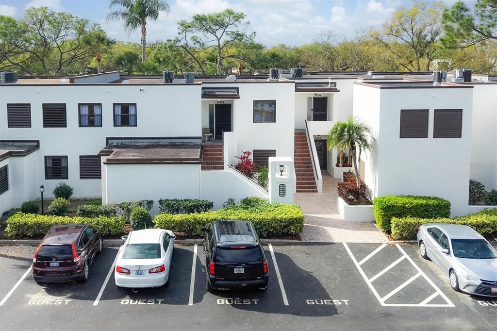 5058 Marsh Field Road, Unit 8 Sarasota, FL 34235 - Photo 29 of 73 a car parked in front of a white house