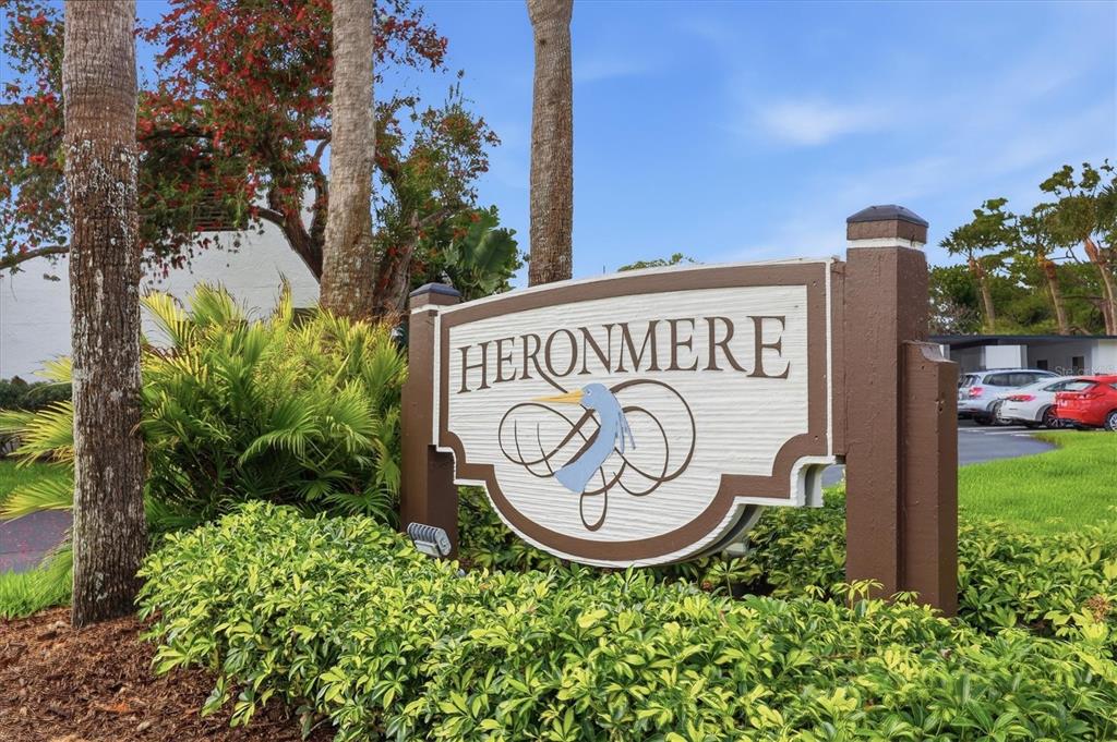 5058 Marsh Field Road, Unit 8 Sarasota, FL 34235 - Photo 33 of 73 a view of sign board with yard and trees