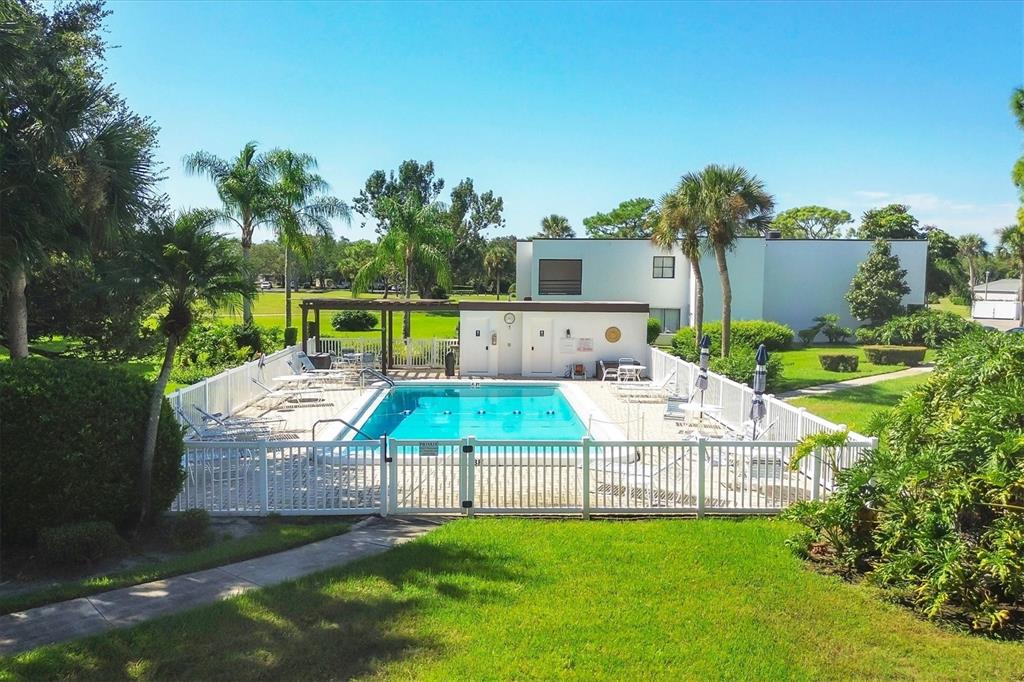 5058 Marsh Field Road, Unit 8 Sarasota, FL 34235 - Photo 38 of 73 a view of backyard with swimming pool and seating space