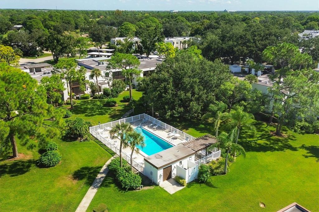 5058 Marsh Field Road, Unit 8 Sarasota, FL 34235 - Photo 40 of 73 an aerial view of residential house with outdoor space and trees all around