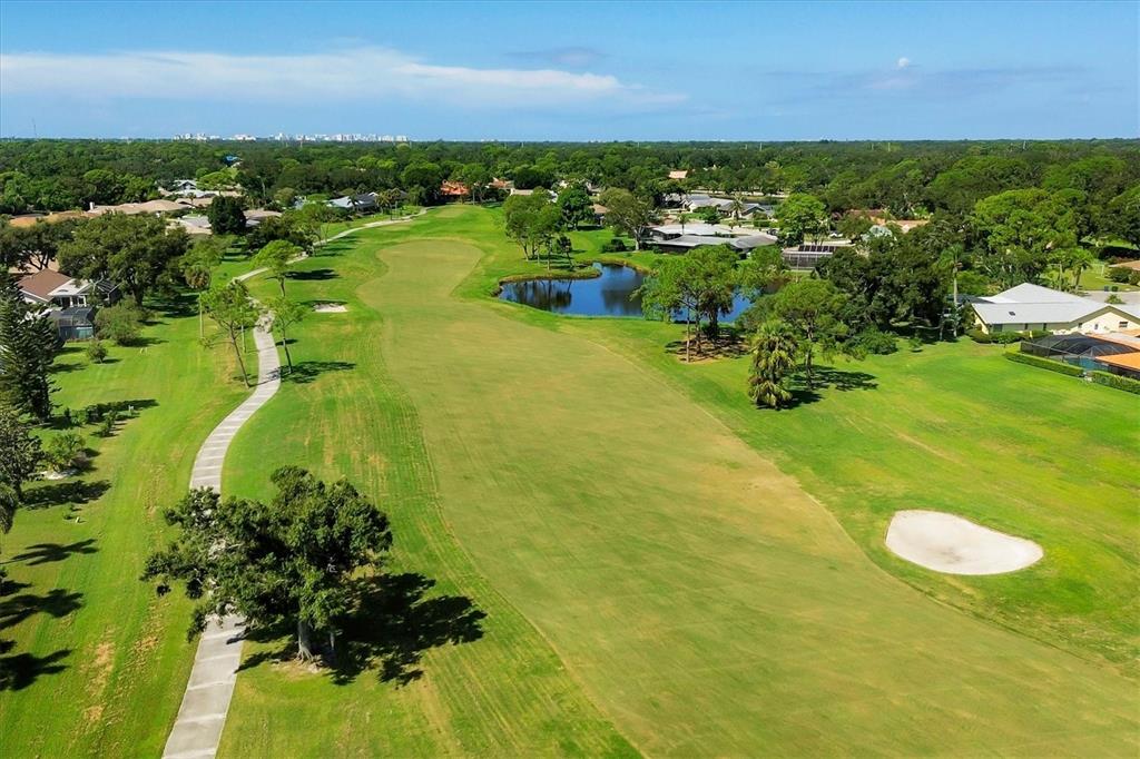 5058 Marsh Field Road, Unit 8 Sarasota, FL 34235 - Photo 46 of 73 a view of a lake with houses
