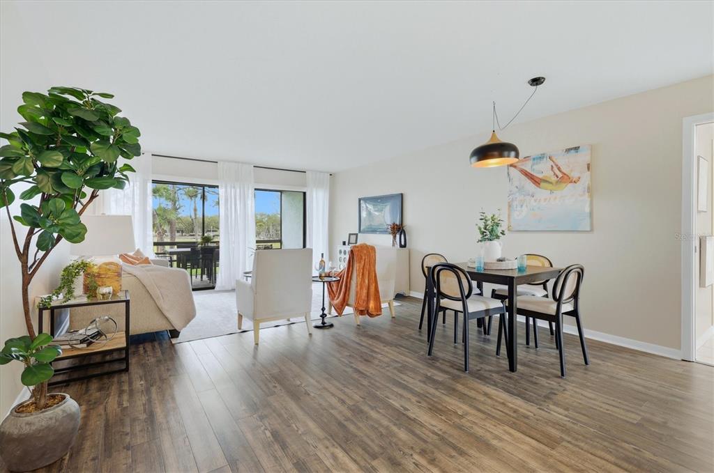 5058 Marsh Field Road, Unit 8 Sarasota, FL 34235 - Photo 6 of 73 a view of a livingroom with furniture and wooden floor